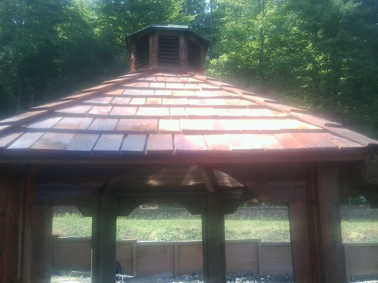 New cedar shake roof and cupola on a lakeside gazebo in Westchester